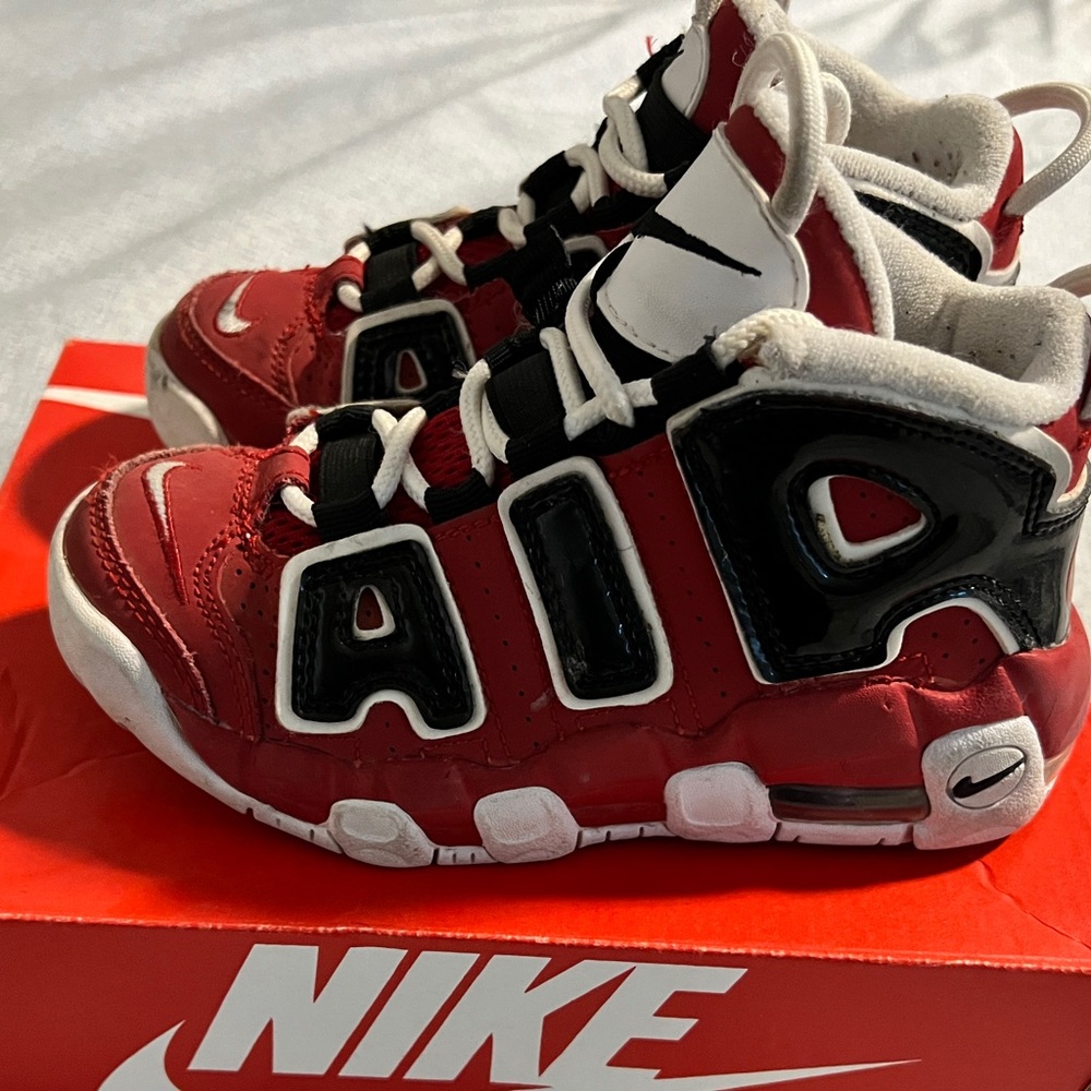 Selling a red and black pair of air more uptempos